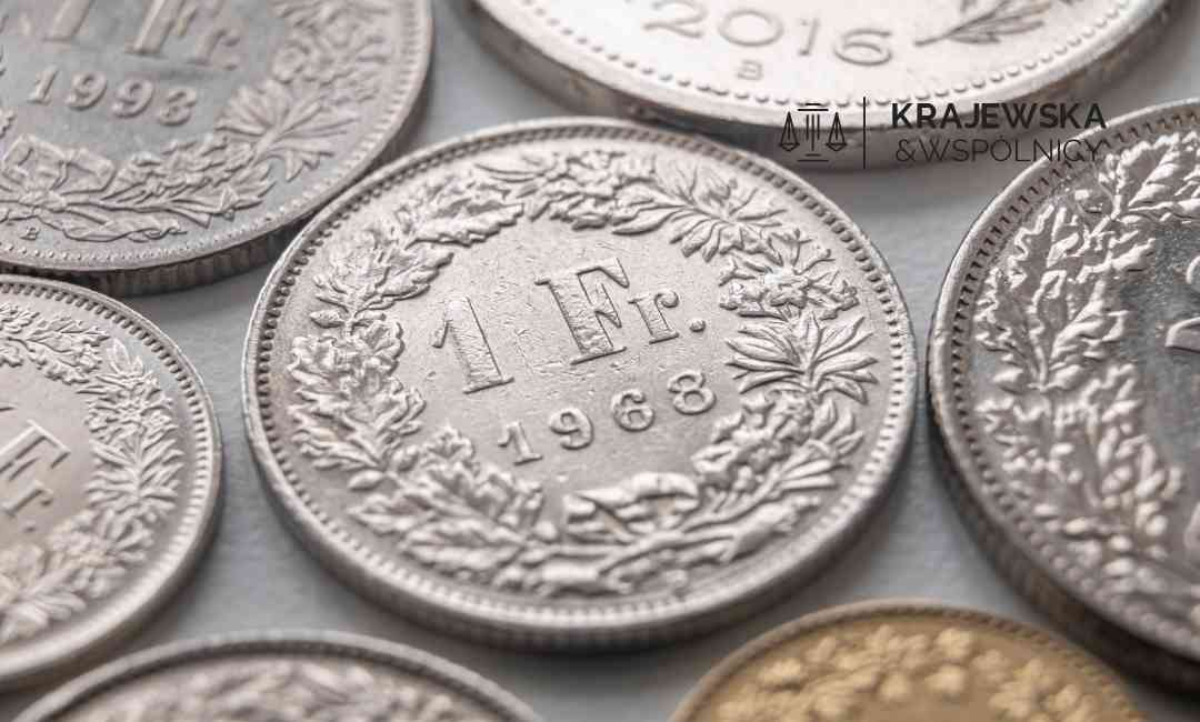 Close-up of several silver coins showing the denomination 1 Ft and years around 1988, with ornate leaf wreath designs.